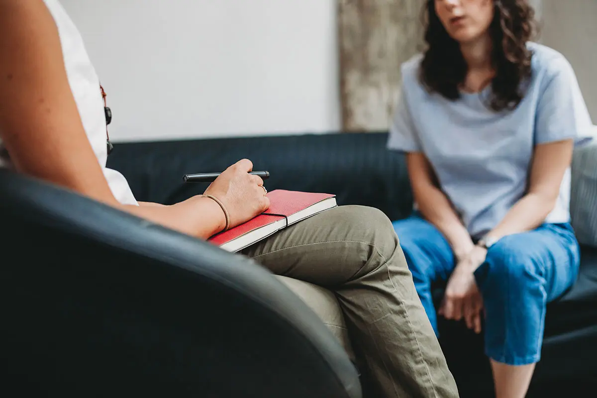 woman speaking with a therapist